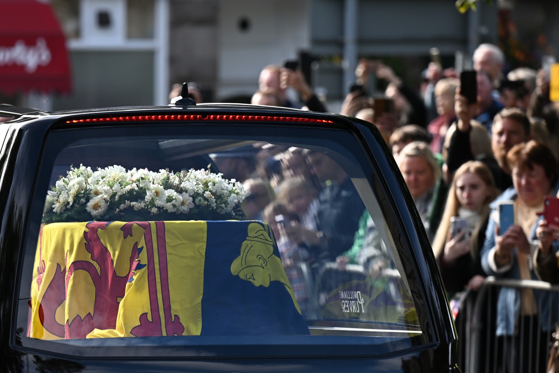 Queen Elizabeth II begins solemn final journey